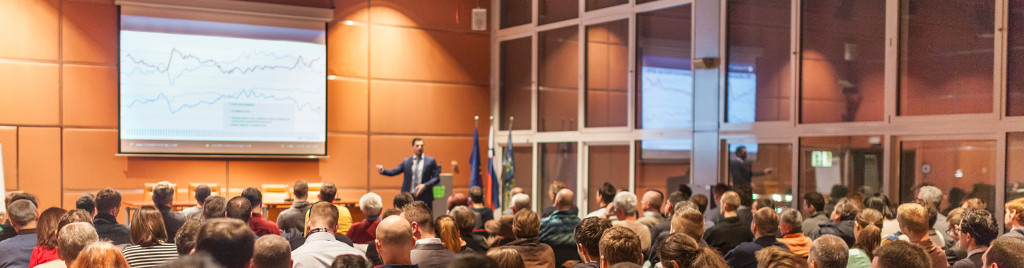 Business speaker giving a talk in conference hall